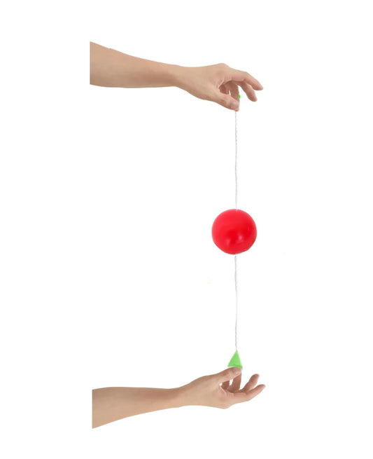Magician performing the interactive stop ball magic prop.