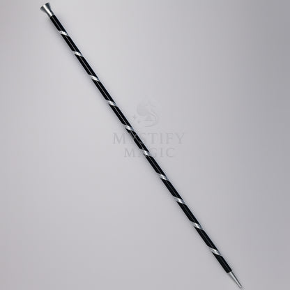 Magician performing the floating aluminum dancing cane magic trick on stage.