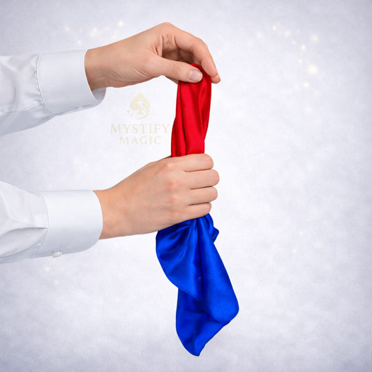 Magician performing the Tarbell color changing silk magic trick with pure silk.