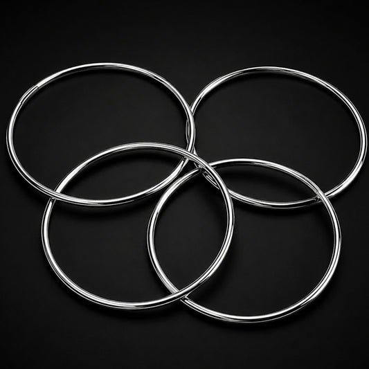 Set of four 4-inch Chinese Linking Rings in silver metal.