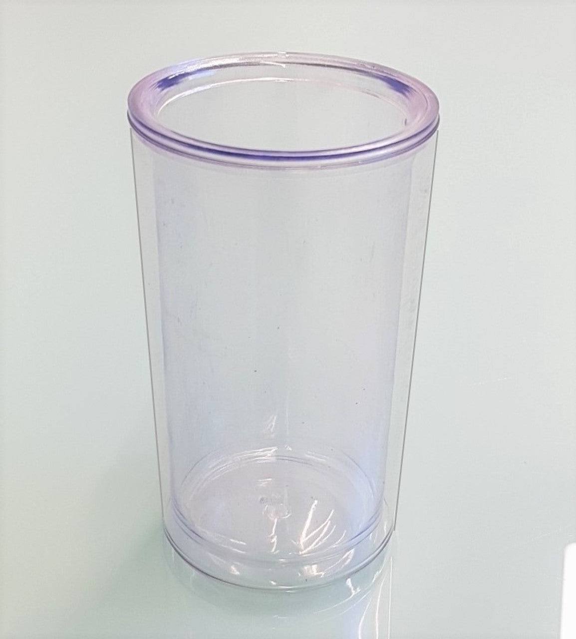 Transparent disappearing liquid glass prop - close-up side angle