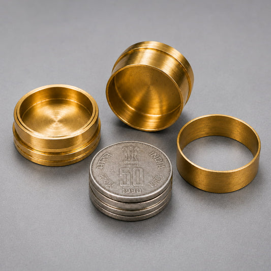 Solid brass cylinders for the vanishing coins stack magic trick.